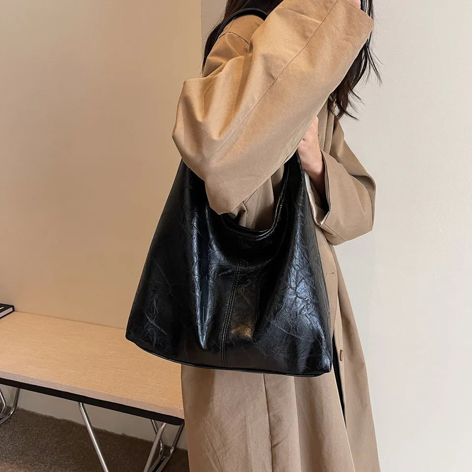 Women's large capacity PU shoulder tote bag in brown with sewing line detail and single strap