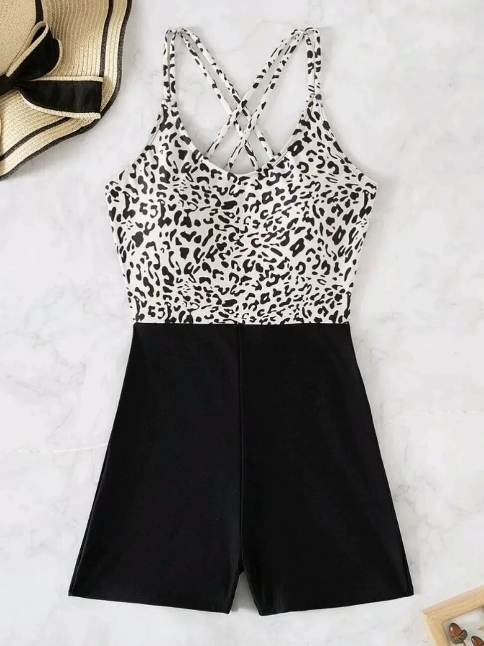 Women's one-piece leopard print crossover lace up slimming hip swimsuit in black and white leopard print