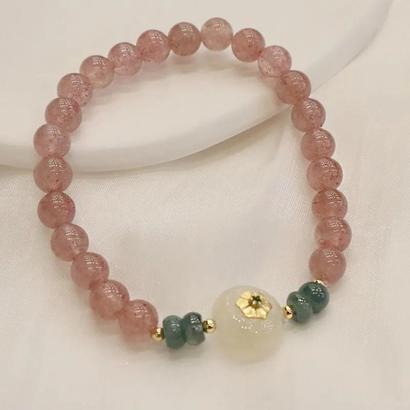Women's strawberry quartz bracelet with blue water emerald stones and round jade pendant on geometric chain