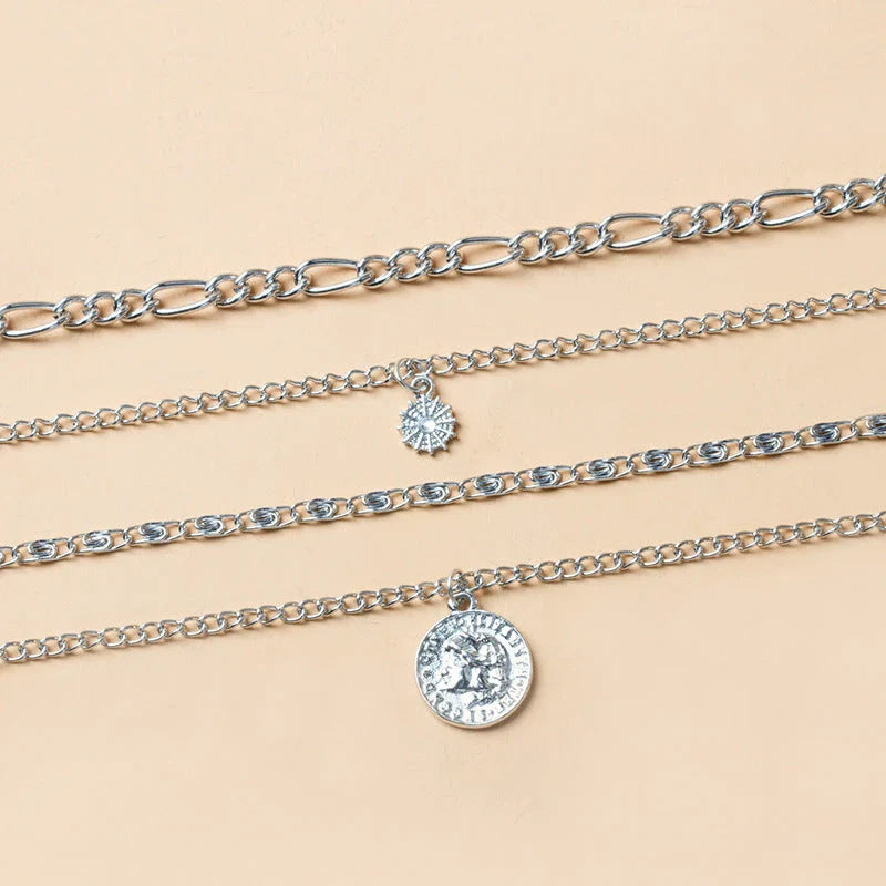 Glamorous layered gold coin necklace for women, featuring a delicate chain and shimmering gold coin charms