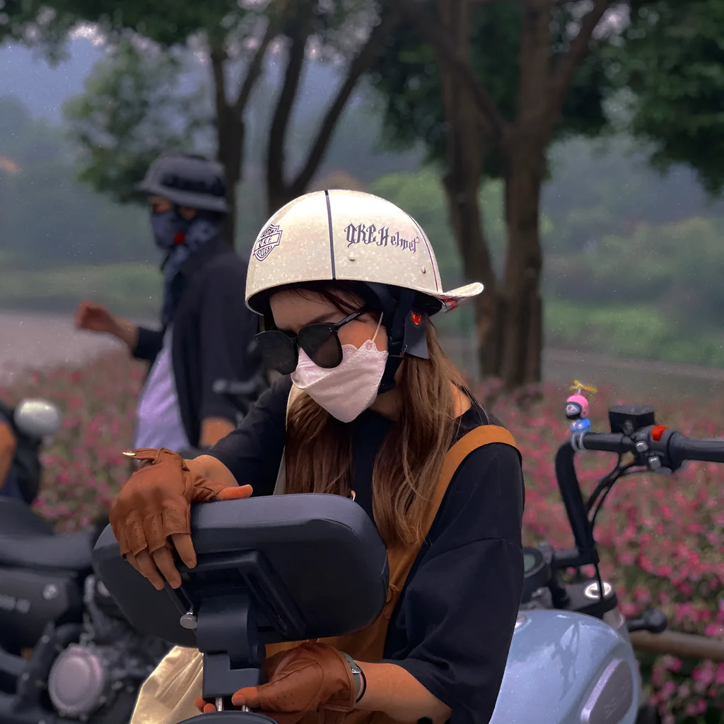 Men's retro half helmet for electric bikes in bright black gradient with blue lens, showing ABS shell construction.
