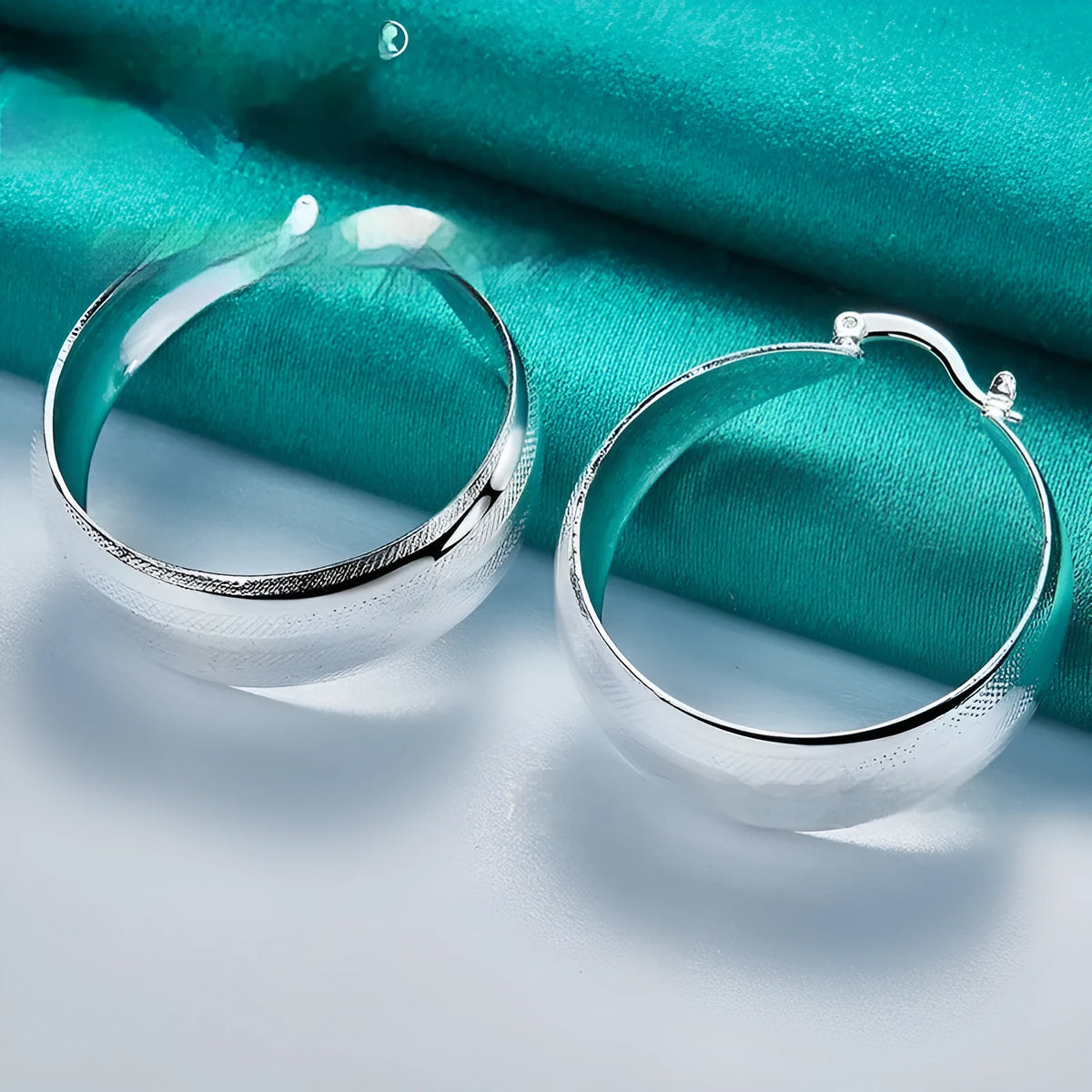 Silver metal round concave earrings for women, metal finish, 2.5 cm diameter, natural circle style