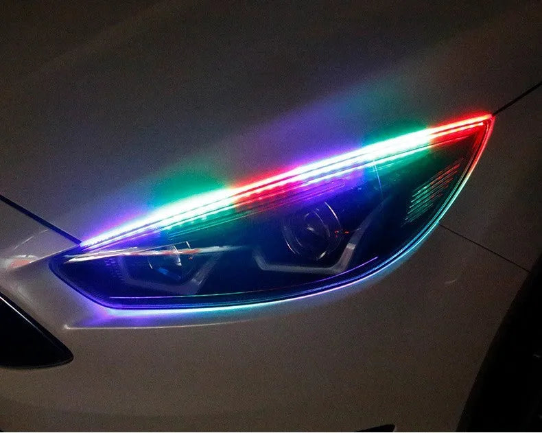 RGB colour LED car daytime running light strip with remote control on a white background.