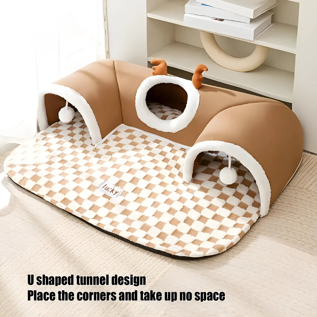 Cat tunnel bed in brown plaid fleece with hanging balls, semi-circular shape, slip-resistant bottom