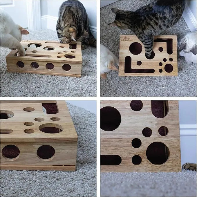 Solid wood square maze cat toy in natural wood colour on a floor