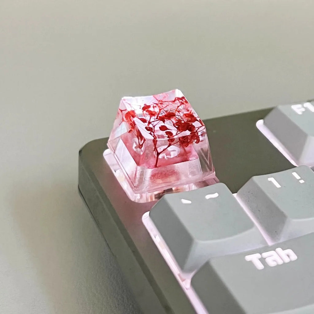 High transparency resin starry sky keycap for mechanical keyboard in green, pink, red, and violet colours.