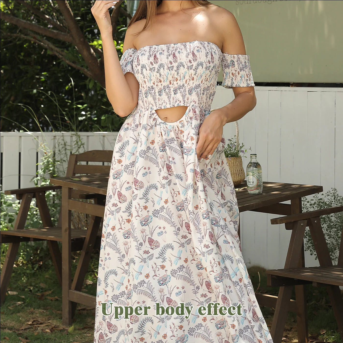 Women's off-shoulder strapless floral dress in a vibrant pattern, perfect for summer outings.