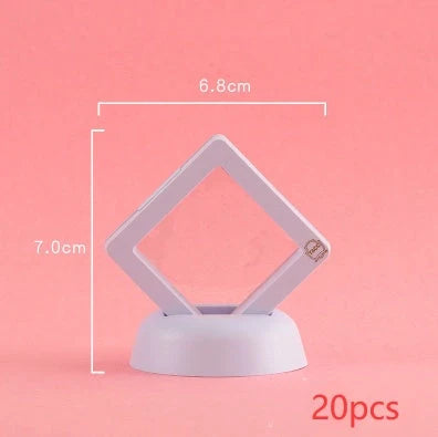 3D floating jewelry display stand showcasing earrings and coins in mid-air