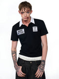 Black slim fit men's polo shirt with embroidery detail on the chest, featuring short sleeves and a polo collar.