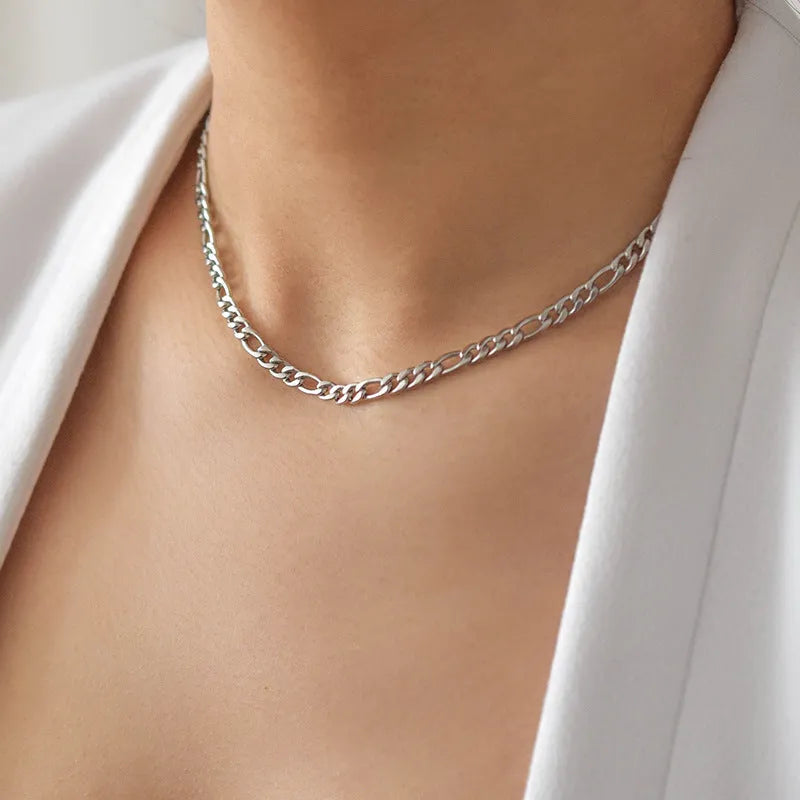 Gold electroplated stainless steel necklace with geometry pendant on white background