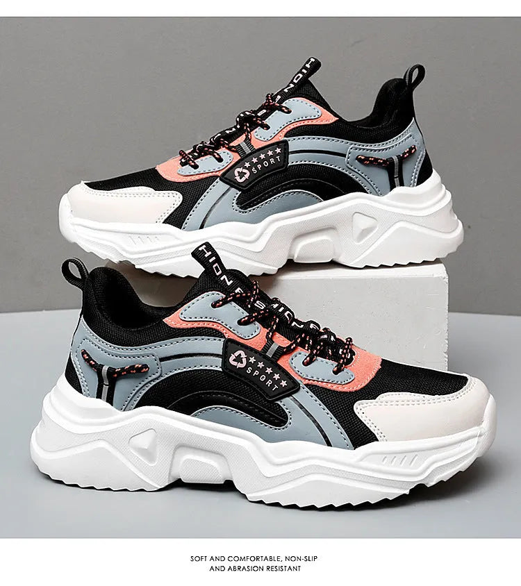 White women's casual sneaker with mesh upper, thick PU sole, buckle detail, and round toe.