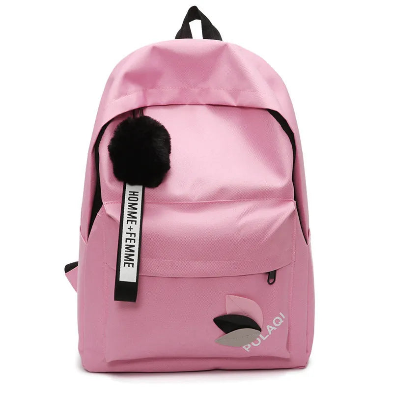 College style canvas rucksack in green with leaf pattern, showing anti-theft features and shoulder straps