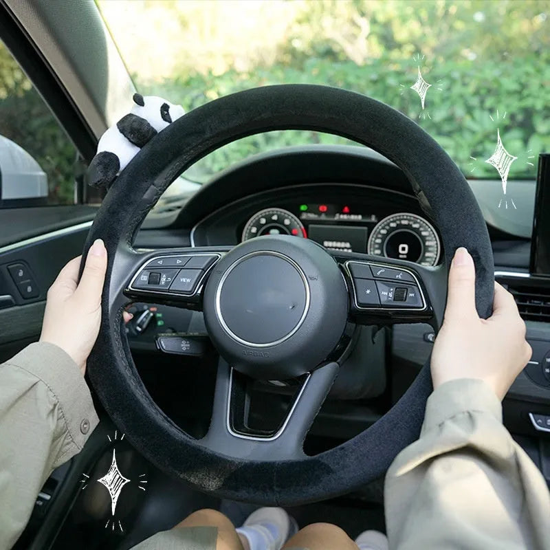 Panda plush black steering wheel cover and matching shoulder pad set for winter vehicle interiors