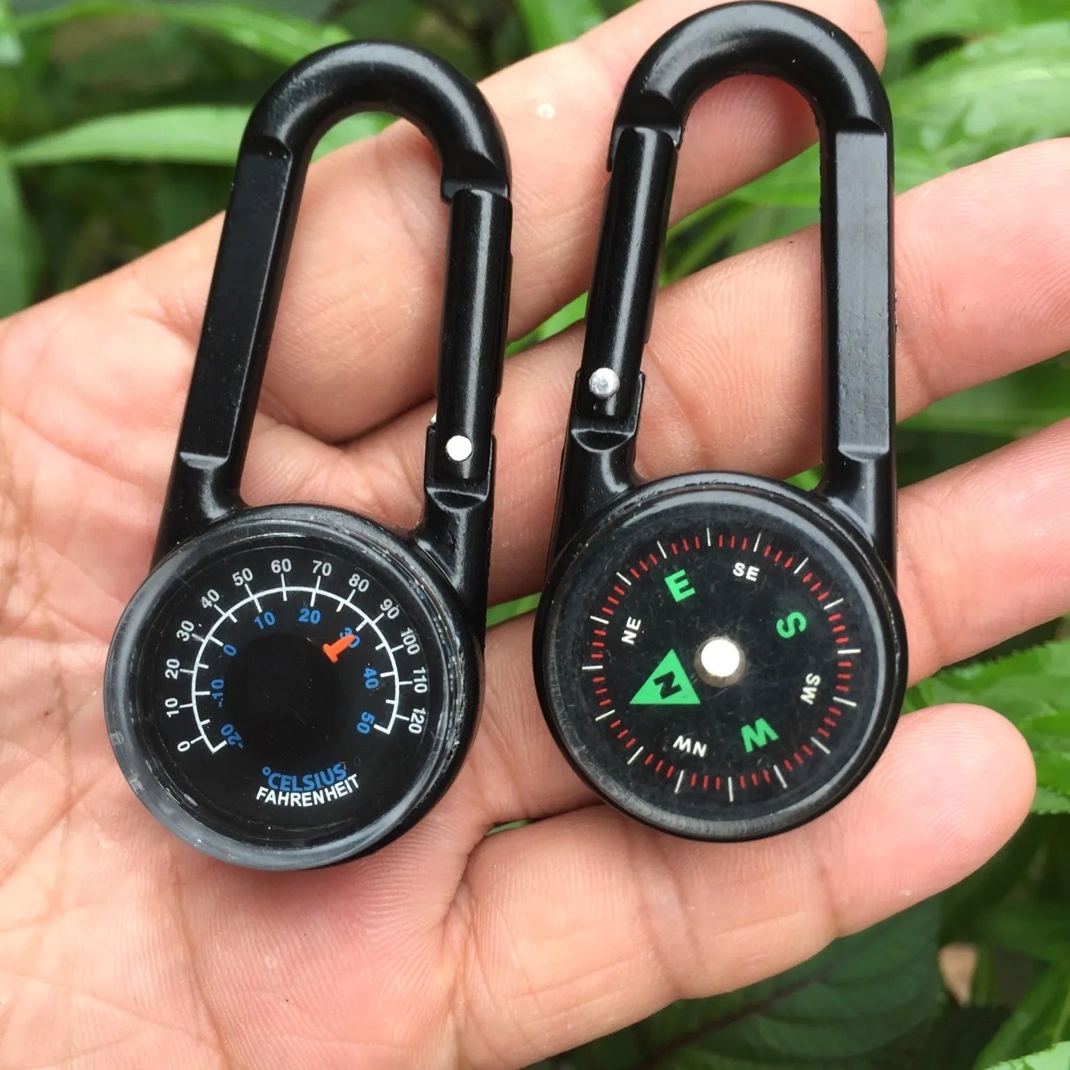 Black zinc alloy double-sided button carabiner with visible thermometer and compass gauge.