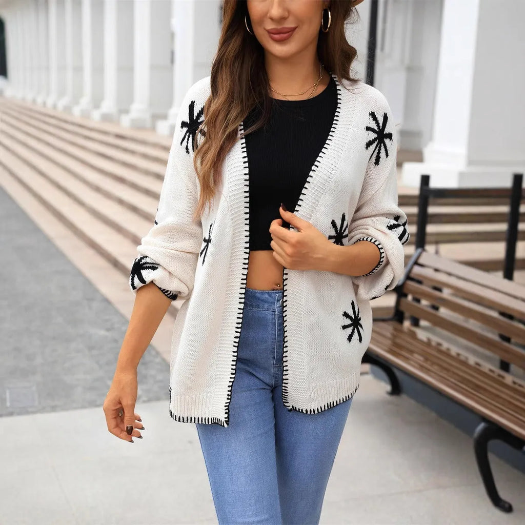 Plus size beige knitted coat with jacquard flower pattern, loose fit, cardigan style.