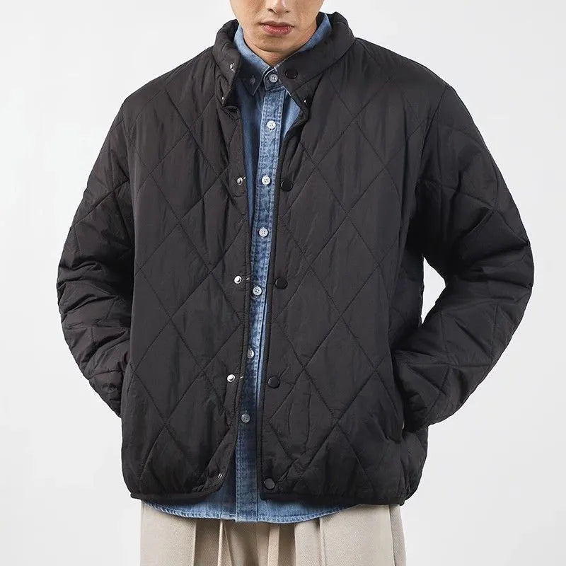 Men's black diamond lattice pattern winter jacket with lengthened cut on mannequin