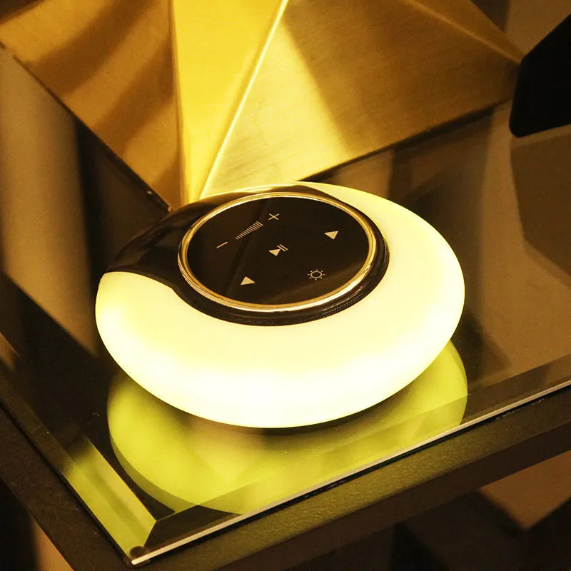 DEAMAK-1 Bluetooth speaker and LED desk lamp in folded position showing touch controls.