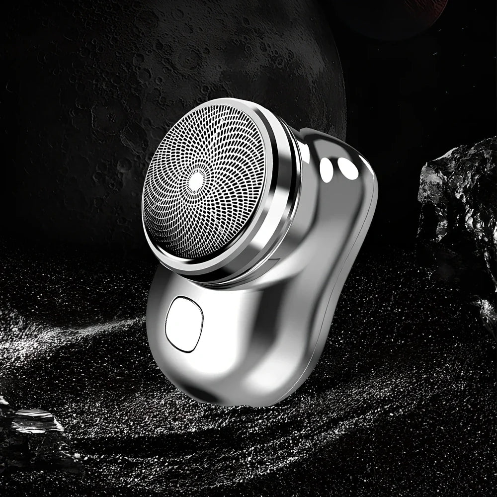 Compact electric mini shaver in cool silver with floating cutter head, 65.8 x 46 x 42mm size, rechargeable for 60+ minutes use