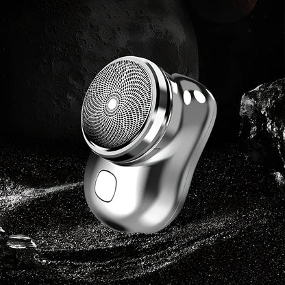 Compact electric mini shaver in cool silver with floating cutter head, 65.8 x 46 x 42mm size, rechargeable for 60+ minutes use