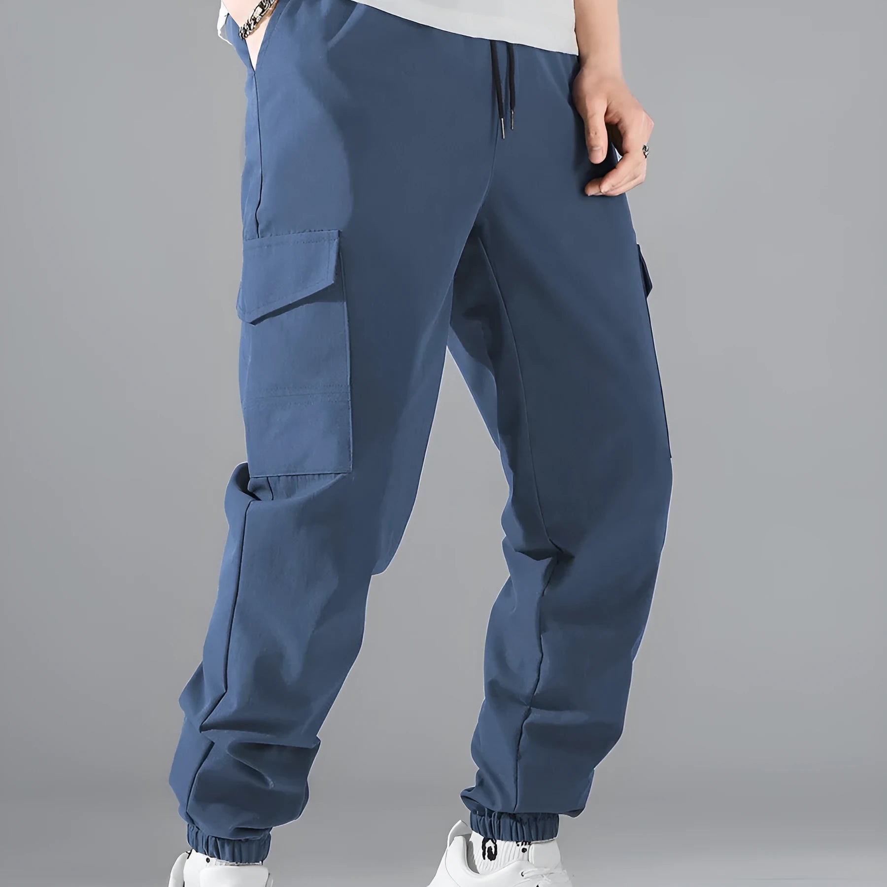 Men's multi-pocket workwear trousers in army green with drawstring waist, side and back pockets, straight leg cut