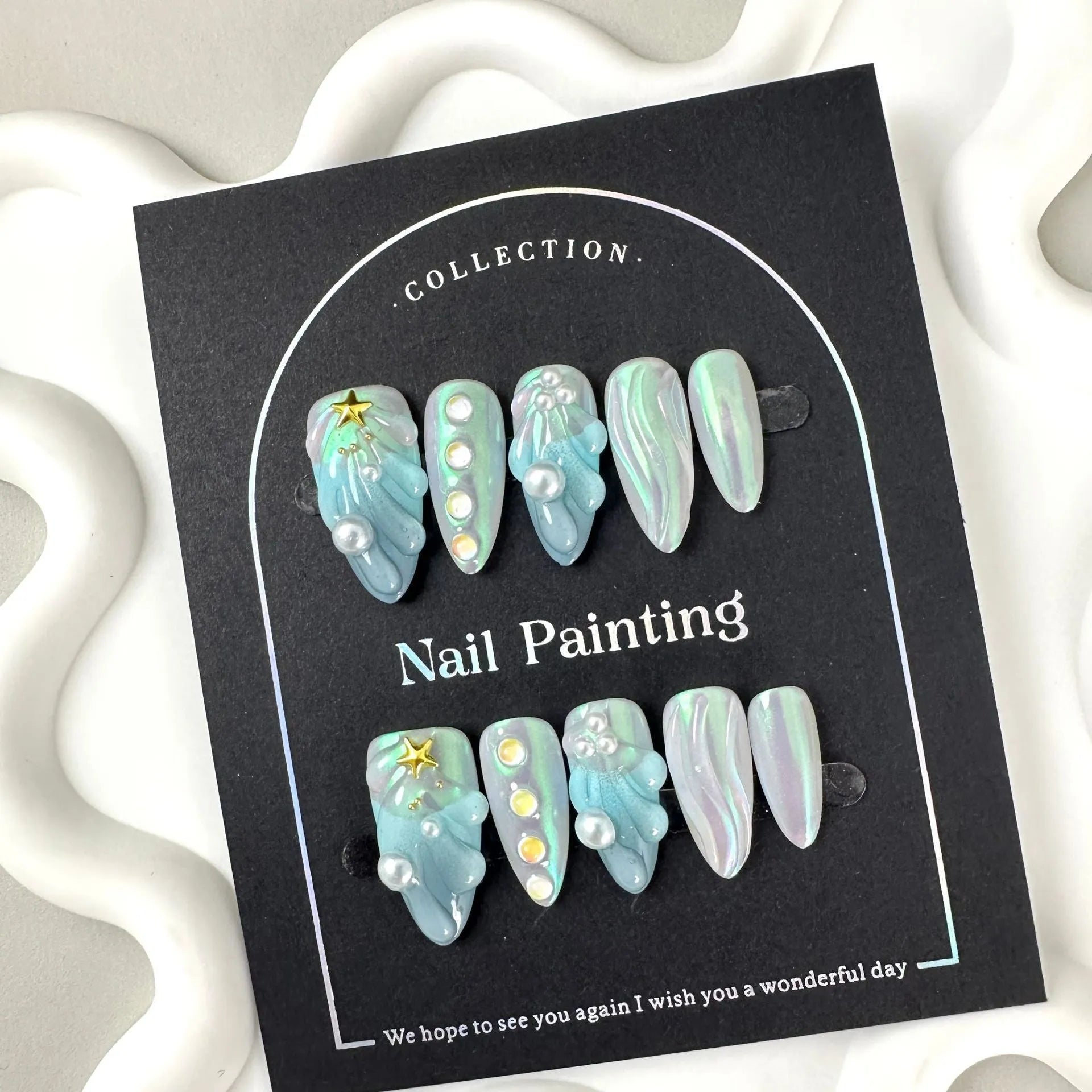Blue plastic shell-shaped artificial nail stickers in four sizes XS S M L