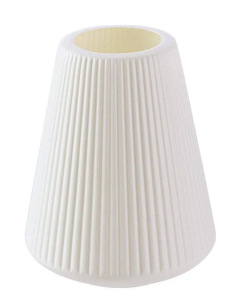 Colourful melamine plastic decorative flower vase on a desk, showing white, pink, green, and blue colour options.