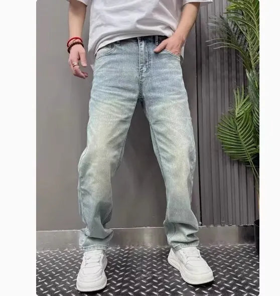 Light blue straight slim denim trousers for teenagers with mid-rise waist and zipper fly closure