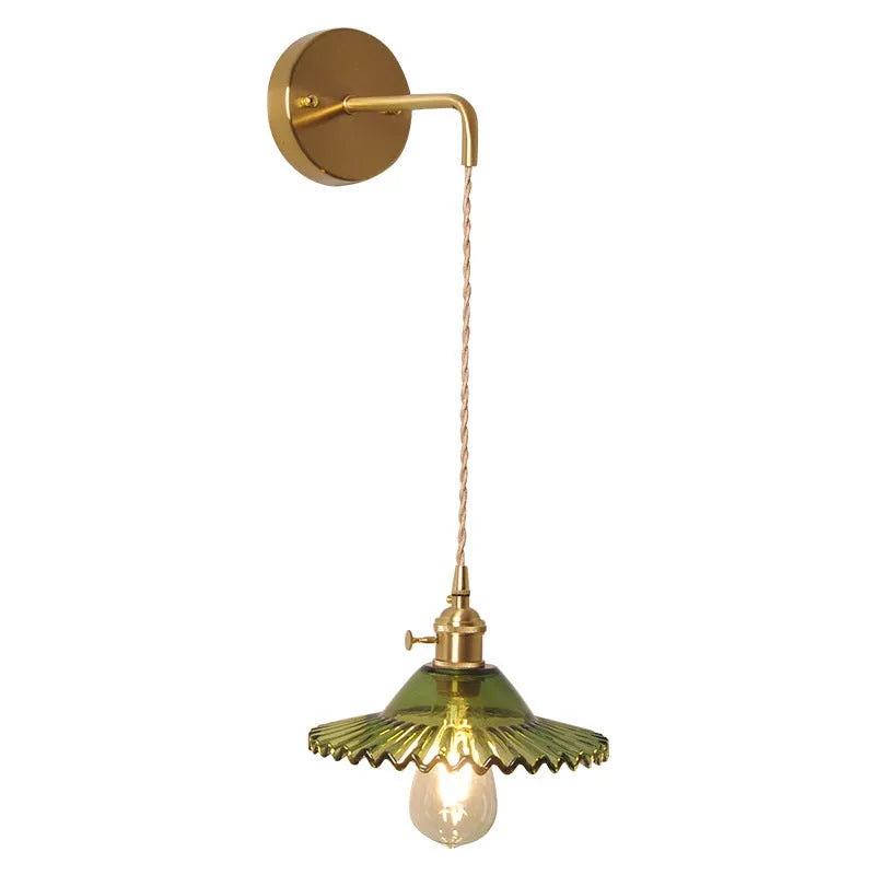 Retro copper lotus wall lamp with glass shade in choice of six colours on a wall.