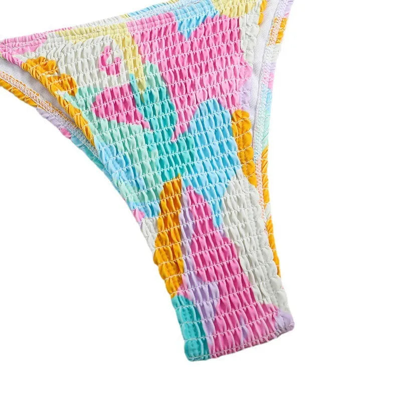 Women's triangle bikini swimsuit with floral gradient pattern and smocking craft detailing