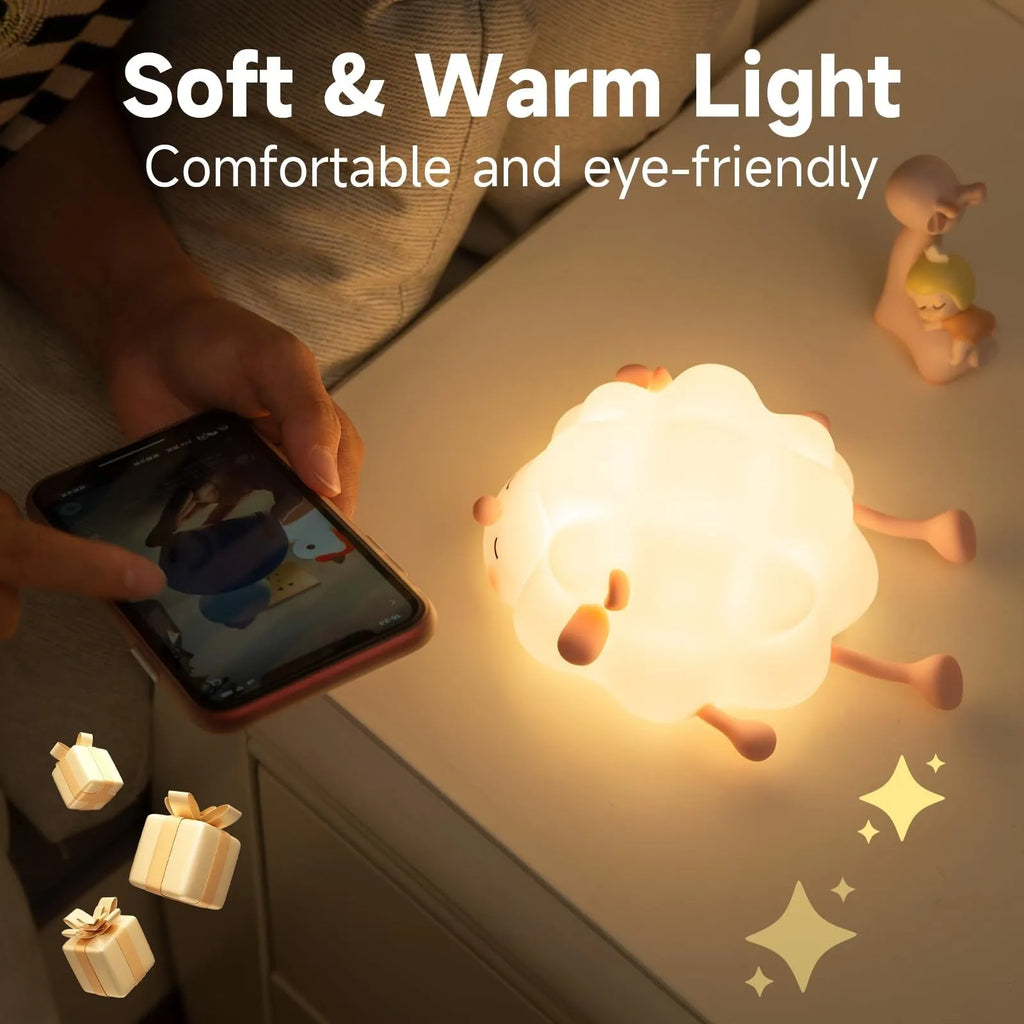 Cute silicone night light sheep cartoon bedroom lamp with warm light, rechargeable, on a bedside table