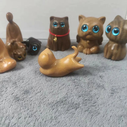 Handcrafted sandalwood kitten ornaments in various styles and colours