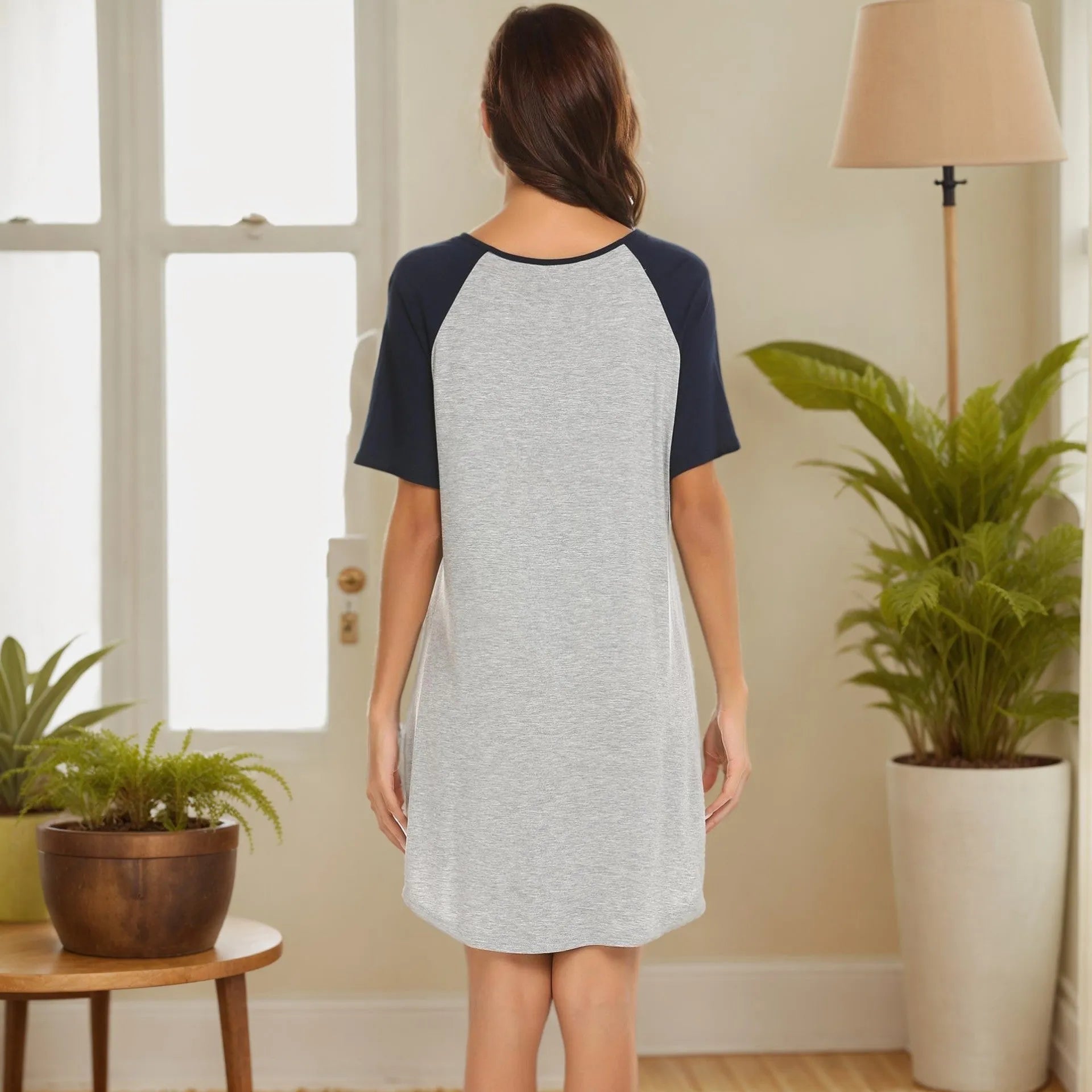 Women's patchwork nightdress with contrasting colour sleeves in navy blue or black.