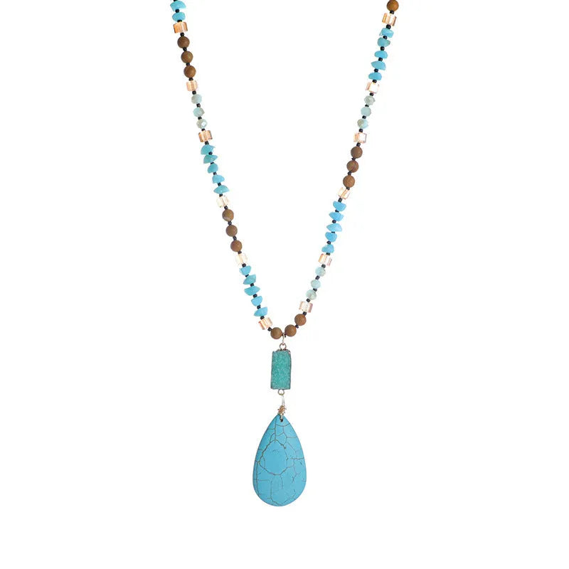 Turquoise water drop shaped pendant necklace with mixed gem inlaid detailing on ball bead chain