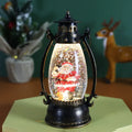 Plastic crystal ball LED oil lamp Christmas ornament with snowman or elderly design on desktop.