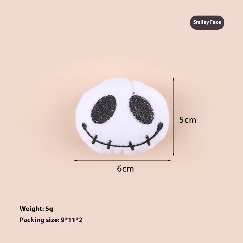 Small plush candy cat teaser wand on a stick in one of three colour designs: Eyes, Candy, or Skull.