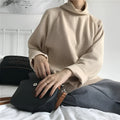 Women's solid colour long sleeve top with a half-high collar in a loose fit, shown in apricot.