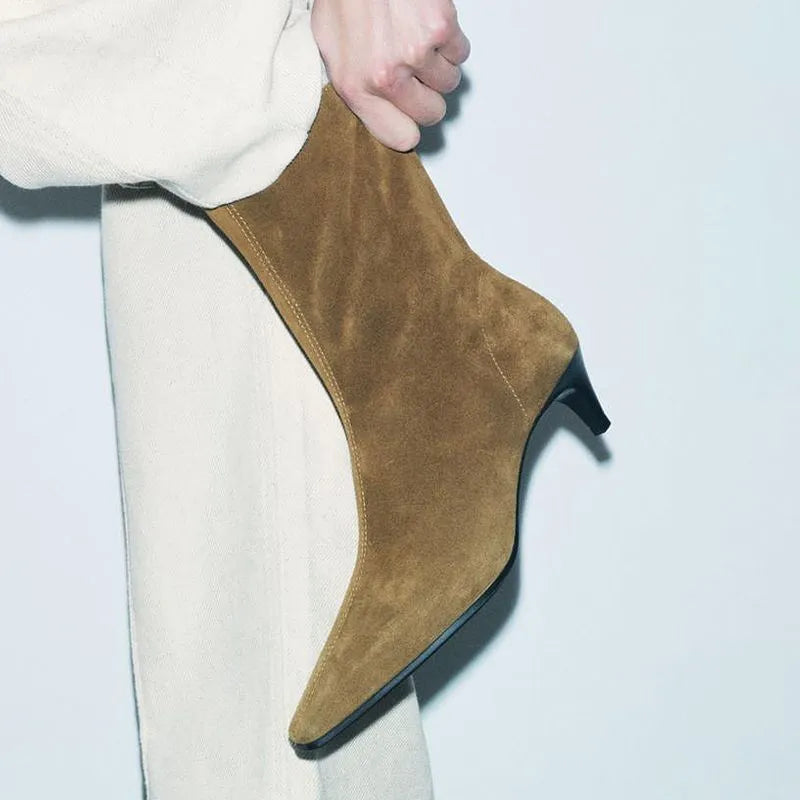 Brown women's square toe ankle boots with a side zipper and a mid-height stiletto heel on a waterproof platform sole.