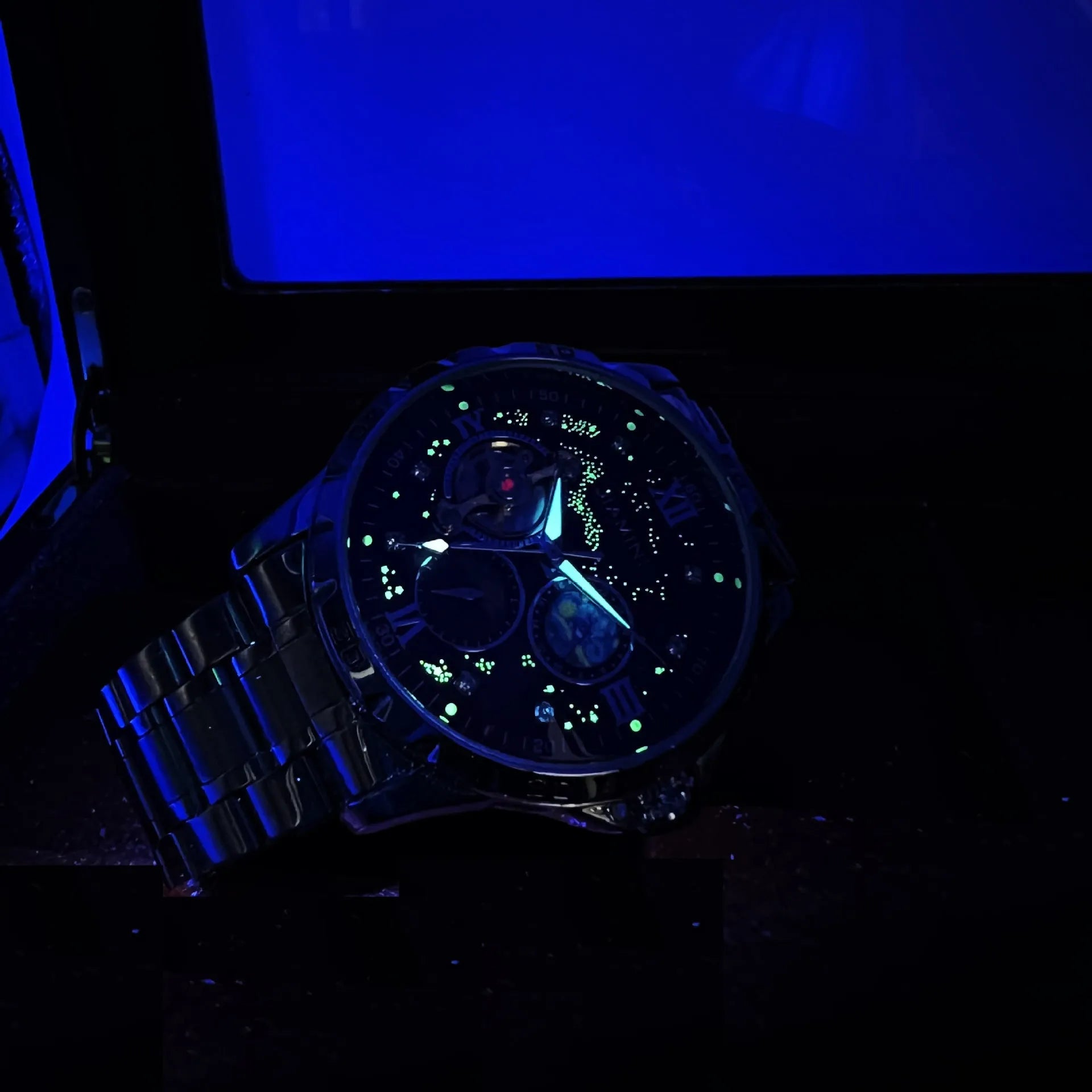 Automatic mechanical men's watch with rose gold case, black dial, and large day-date display.