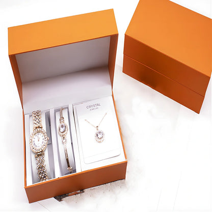 3-piece rhinestone quartz watch set with 22.5cm gold alloy strap, bracelet, and necklace on display