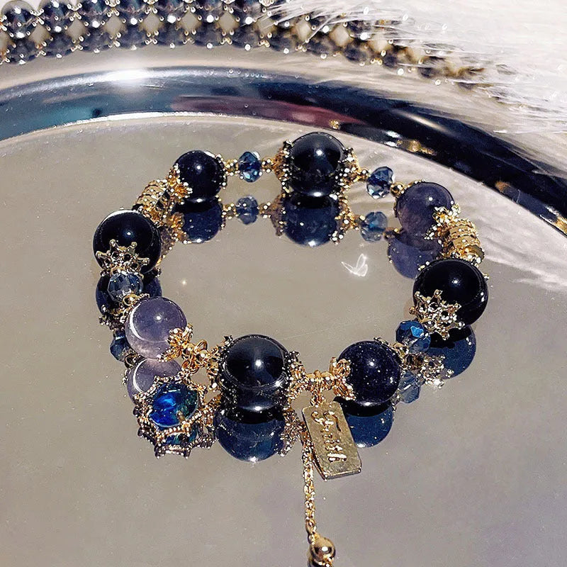 Women's galaxy colour bracelet with snowflake pendant and bow design elements