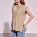 Camel colour V-neck sleeveless loose fit vest with stripe pattern on a hanger