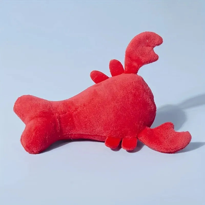 Red lobster stuffed dog toy with flapping tentacles on white background