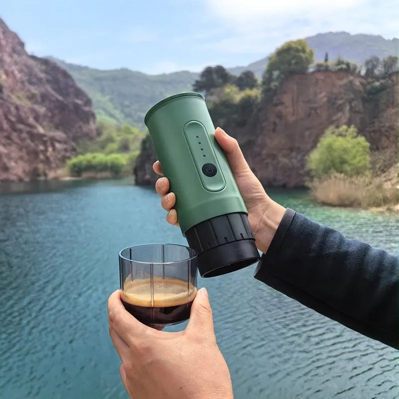 Portable stainless steel coffee machine with car charger, clear spoon, and storage bag in Jungle Green colour.
