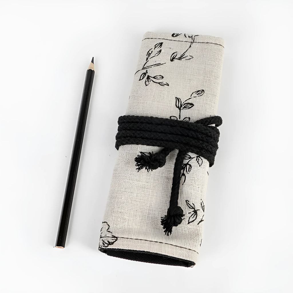 Black peony floral print pencil roll bag open to show multiple pencil slots.