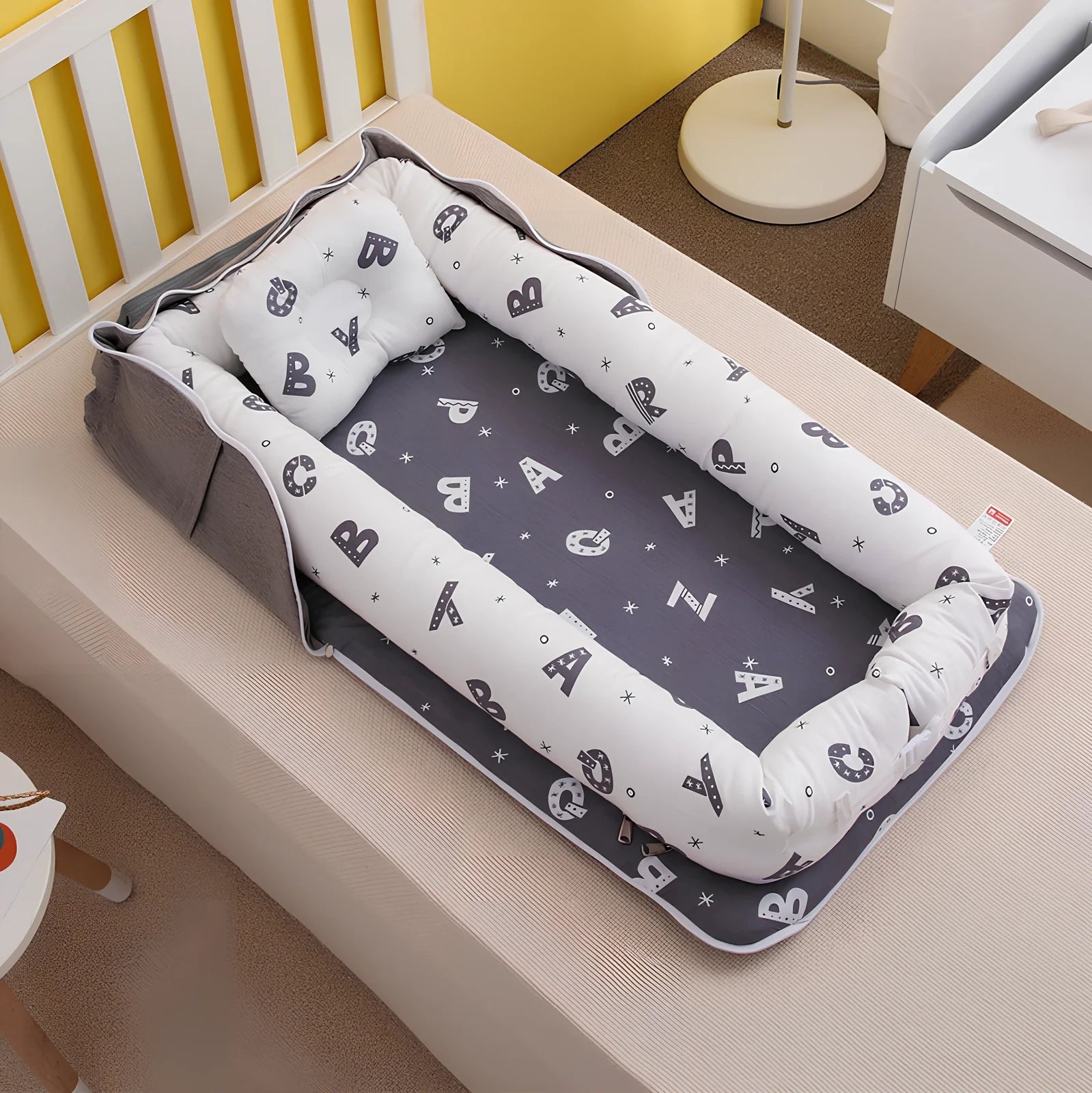 Foldable cotton portable baby crib in Animal World Blue, 90x50 cm with pillow and strap, weighing 1.3 kg