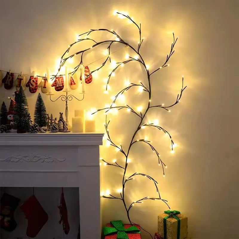 Flexible white birch LED vine light garland bent into decorative shape with warm white lights