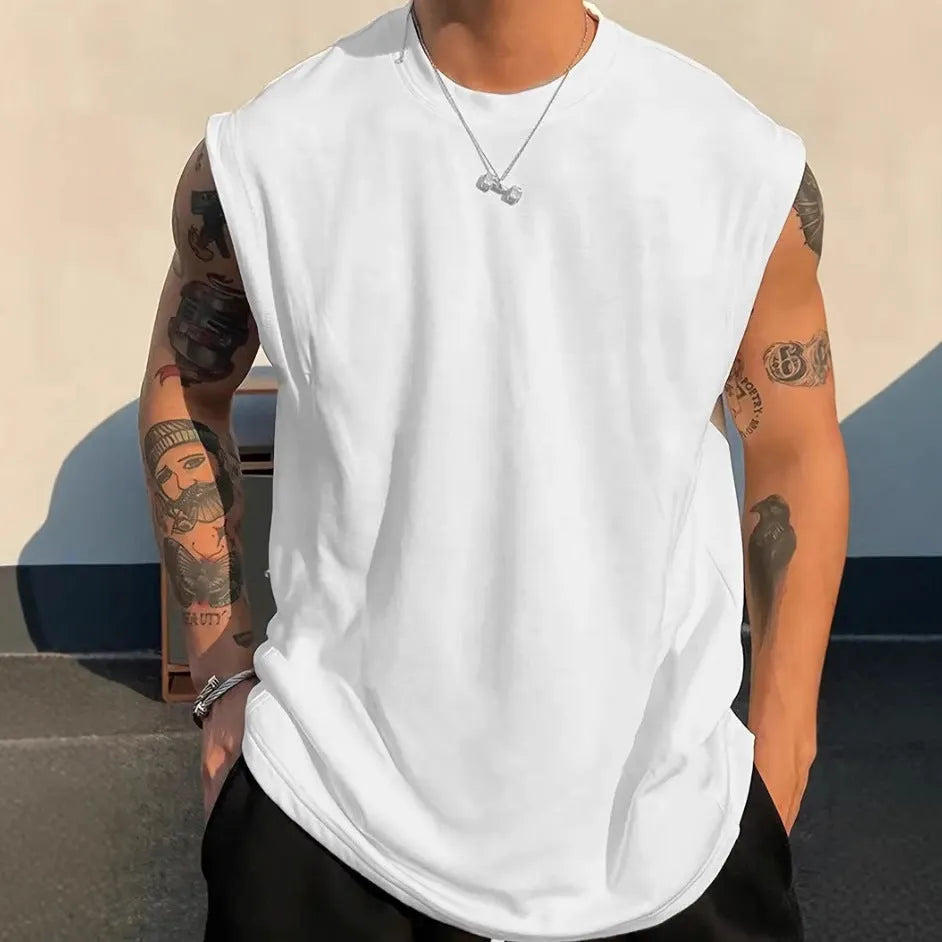 Men's loose solid colour cotton tank top t-shirt on a hanger, showing straight hem and sleeveless design.