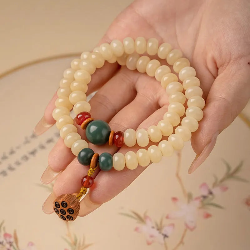 Wooden Bodhi root bracelet with flat round 6x9mm beads in milk butter colour