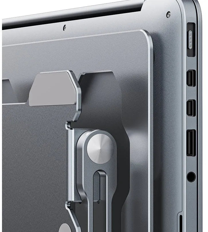 Grey aluminium laptop stand with adjustable angle, shown folded and unfolded next to a laptop.