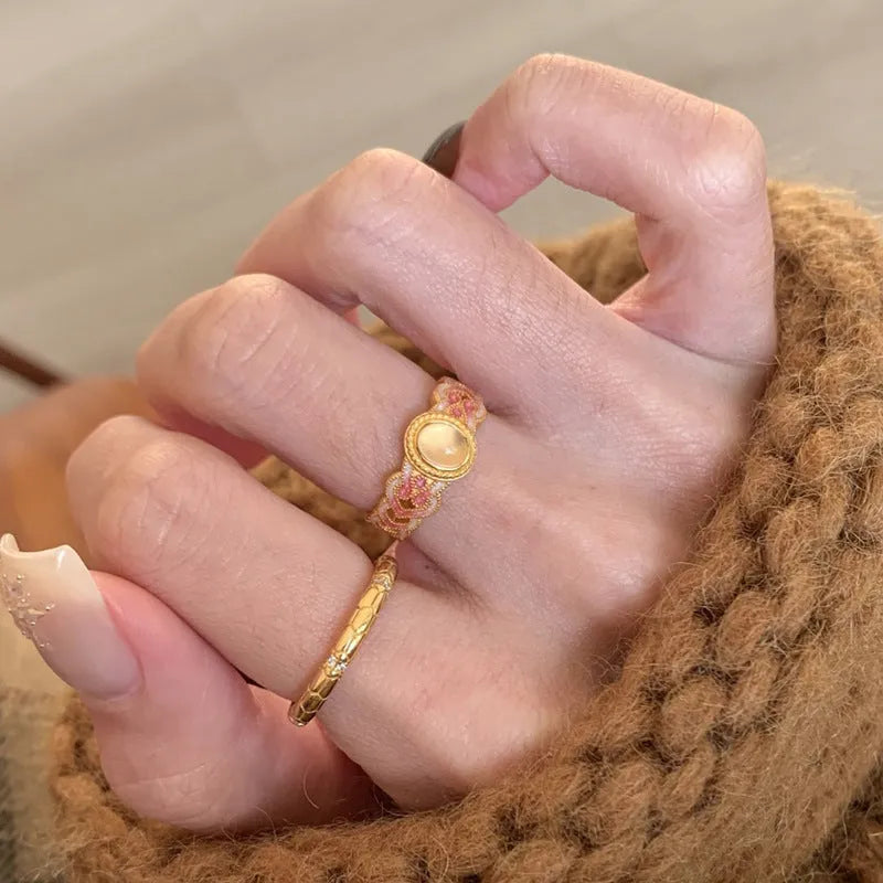 Pink crystal enamel geometric open mouth ring on a gold-plated copper band.